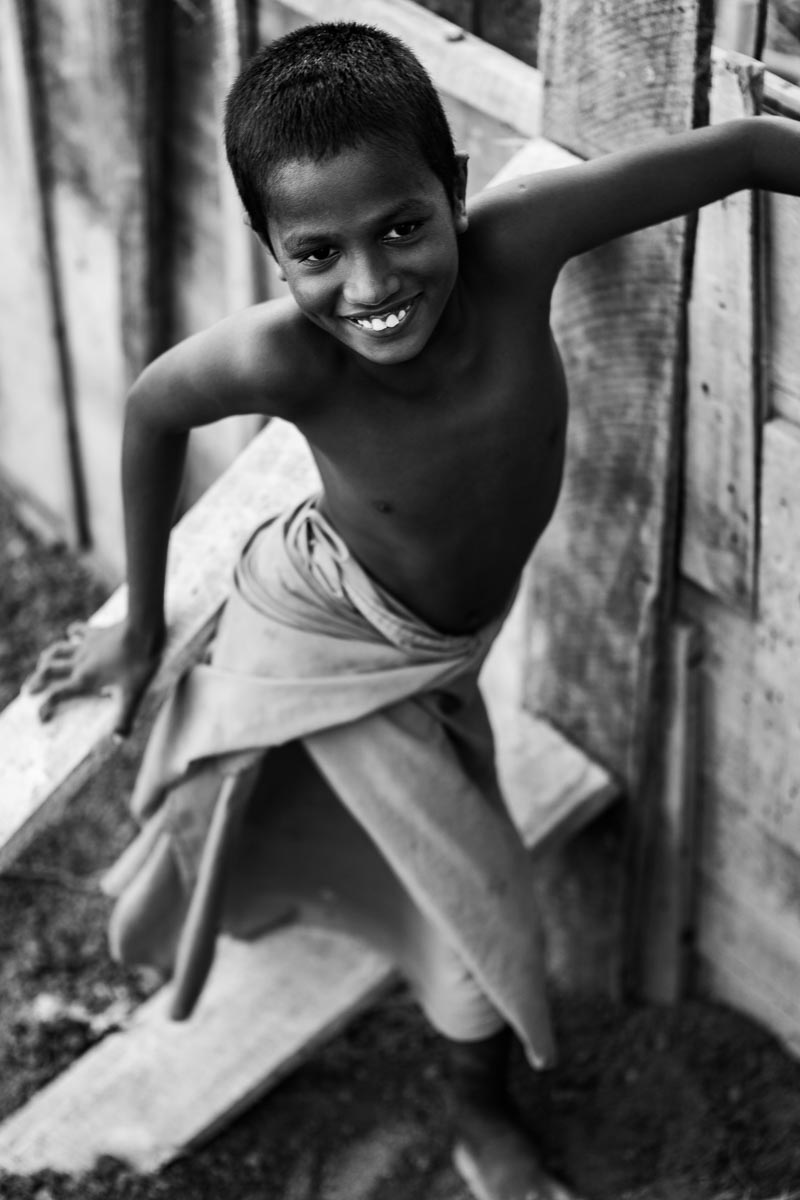 Young boy playing in the trees, Central Sri Lanka 2014