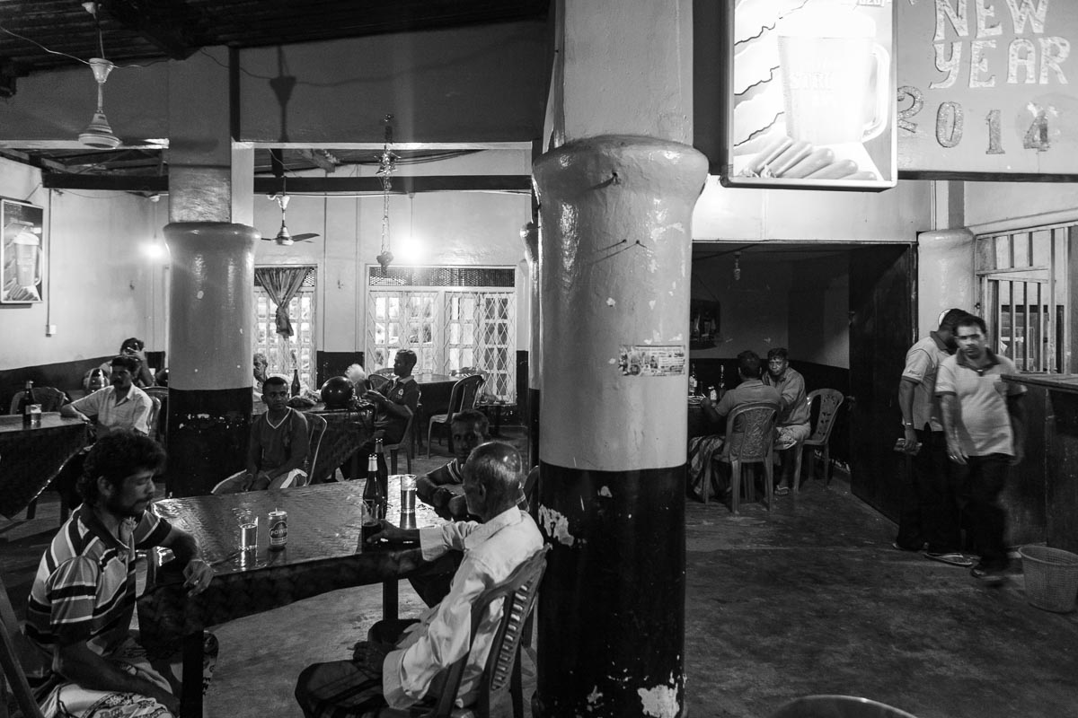 Men at bus station Inn, Sri Lanka 2014